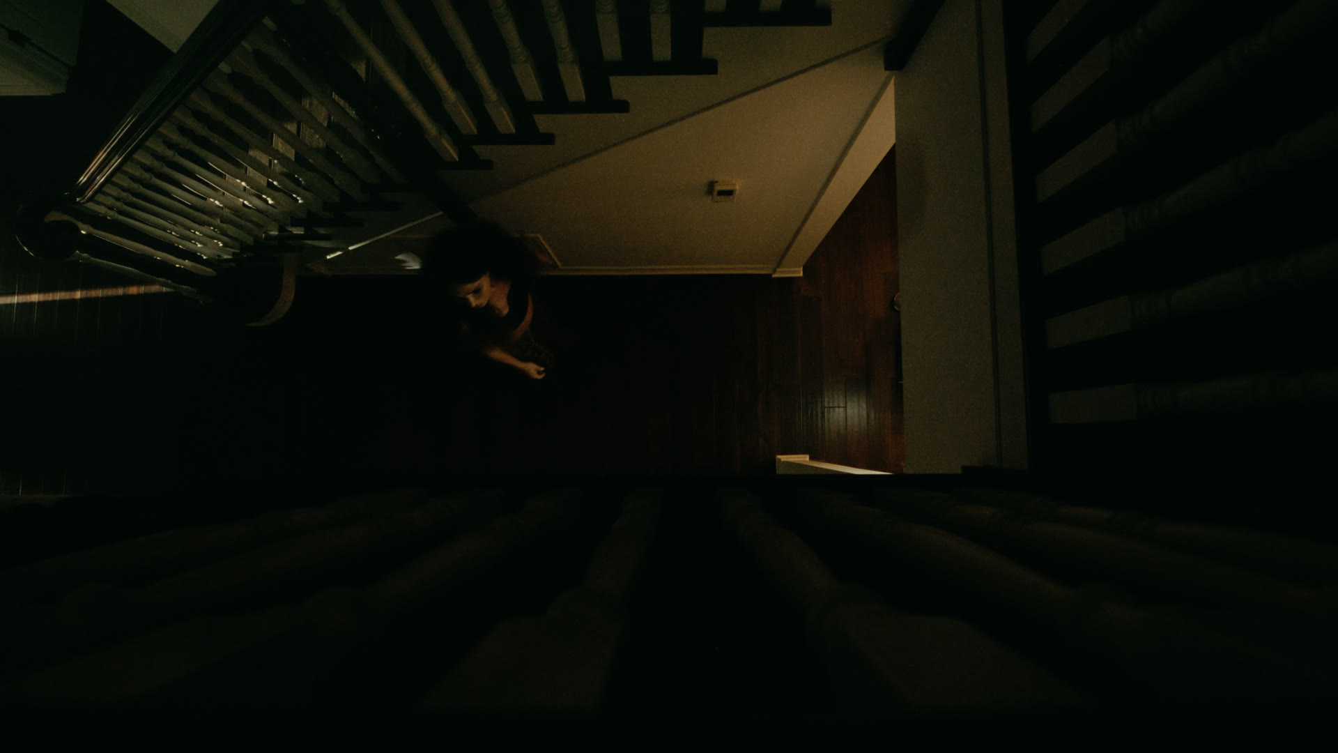 Top-down view of the staircase in shadow — still from Nobody Home