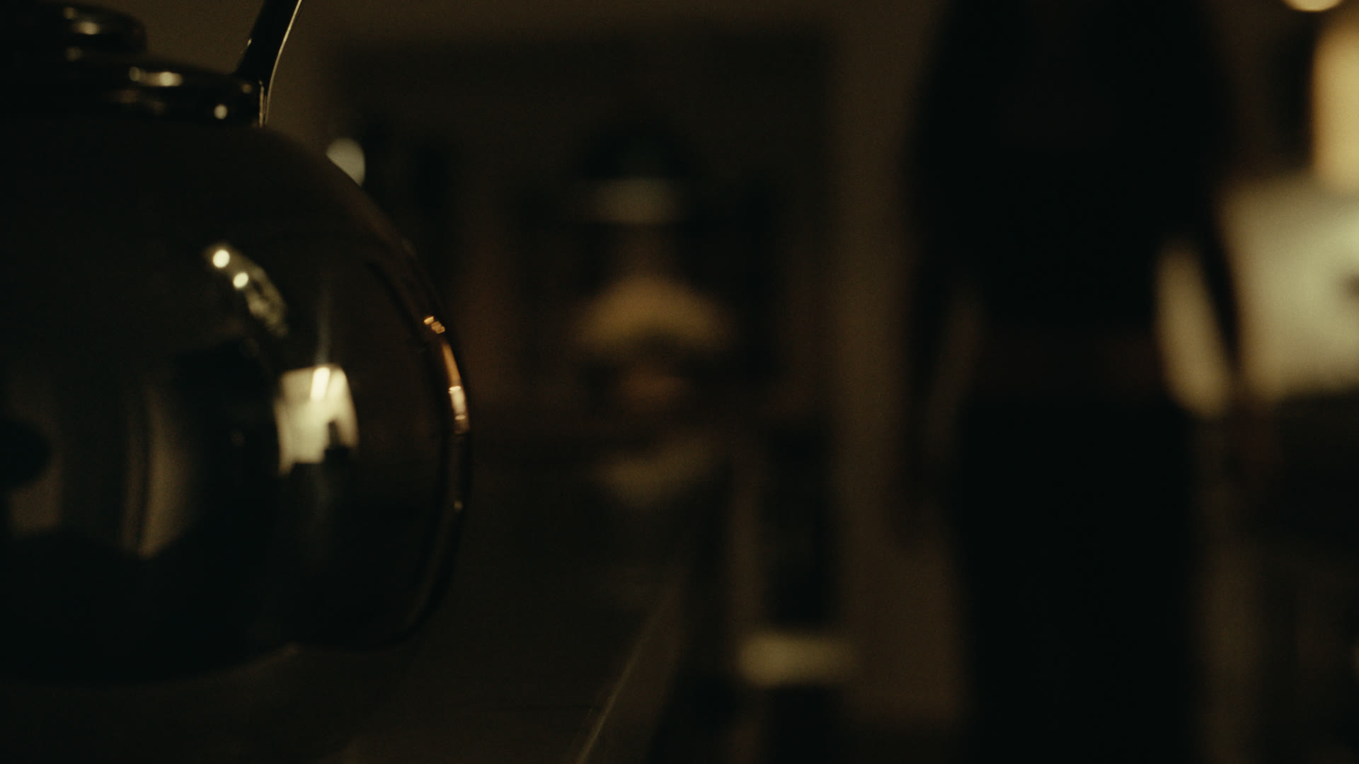 Kitchen scene in low light — still from Nobody Home