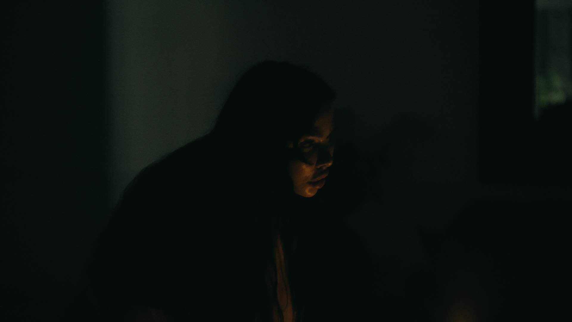 Moving through the dark hallway — still from Nobody Home